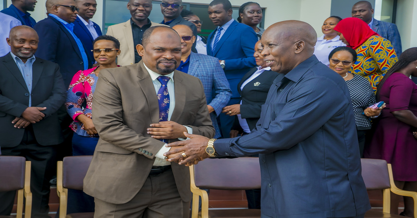Deputy Minister for Finance and Planning, Hamad Chande (left), shakes hands with PPRA Chief Executive Officer, Eliakim Maswi, after the official opening of PPRA Workers Council meeting, recently in Dodoma